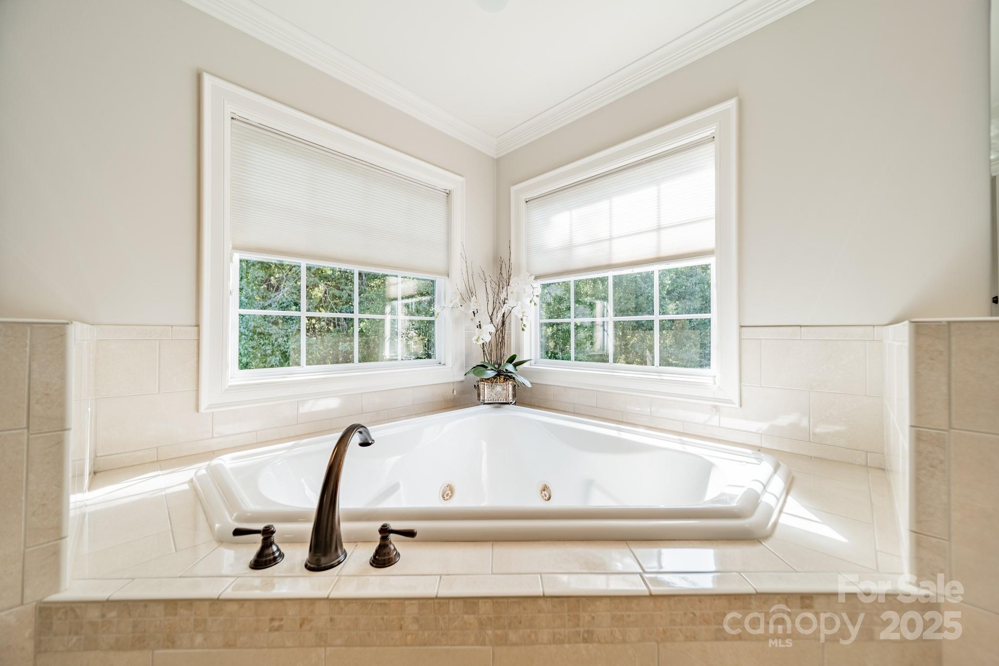 788 Portpatrick Place Fort Mill, SC 29708 - Photo 26 of 48 a white bath tub sitting in a bathroom next to a window