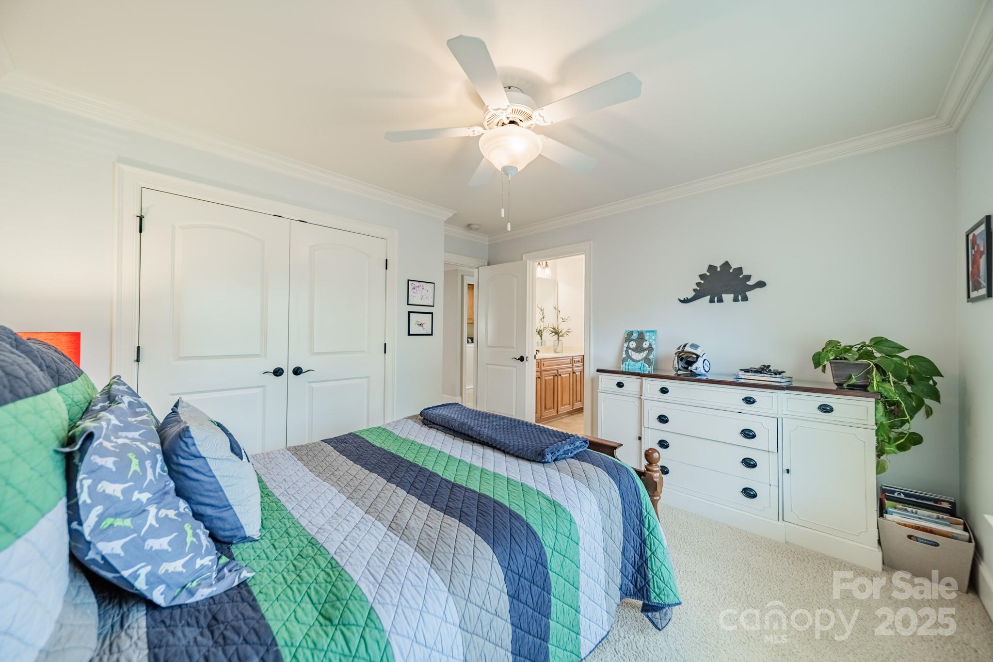 788 Portpatrick Place Fort Mill, SC 29708 - Photo 28 of 48 a spacious bedroom with a bed and a dresser