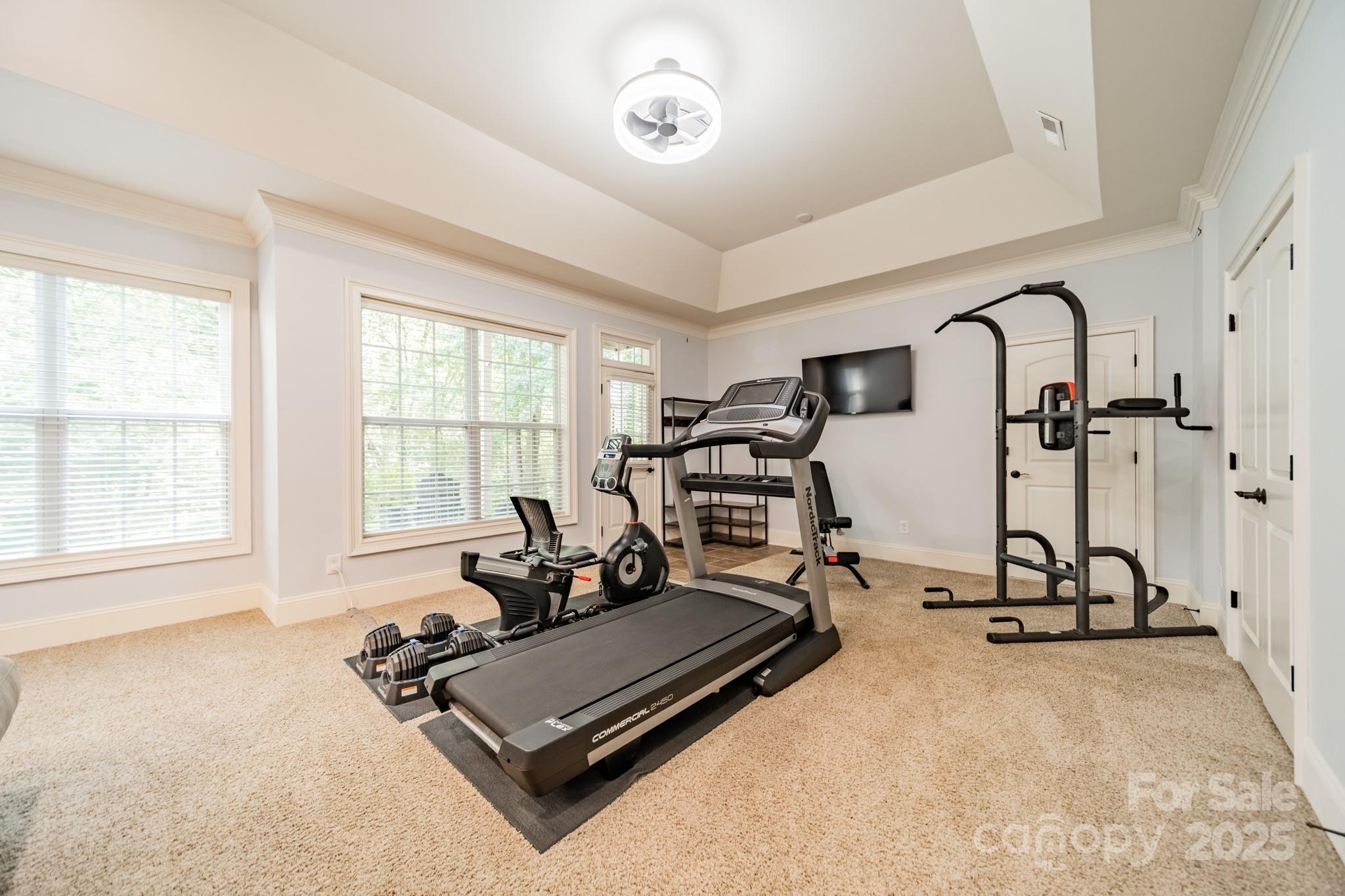 788 Portpatrick Place Fort Mill, SC 29708 - Photo 37 of 48 a room with gym equipment and a large window
