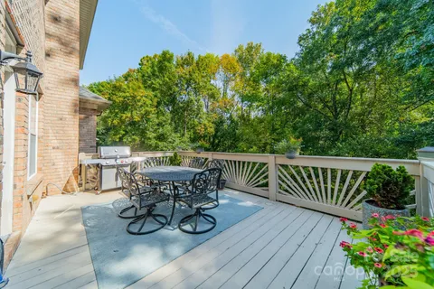 a view of a table and chairs on the roof deck