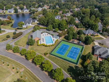 an aerial view of a house with a lake view