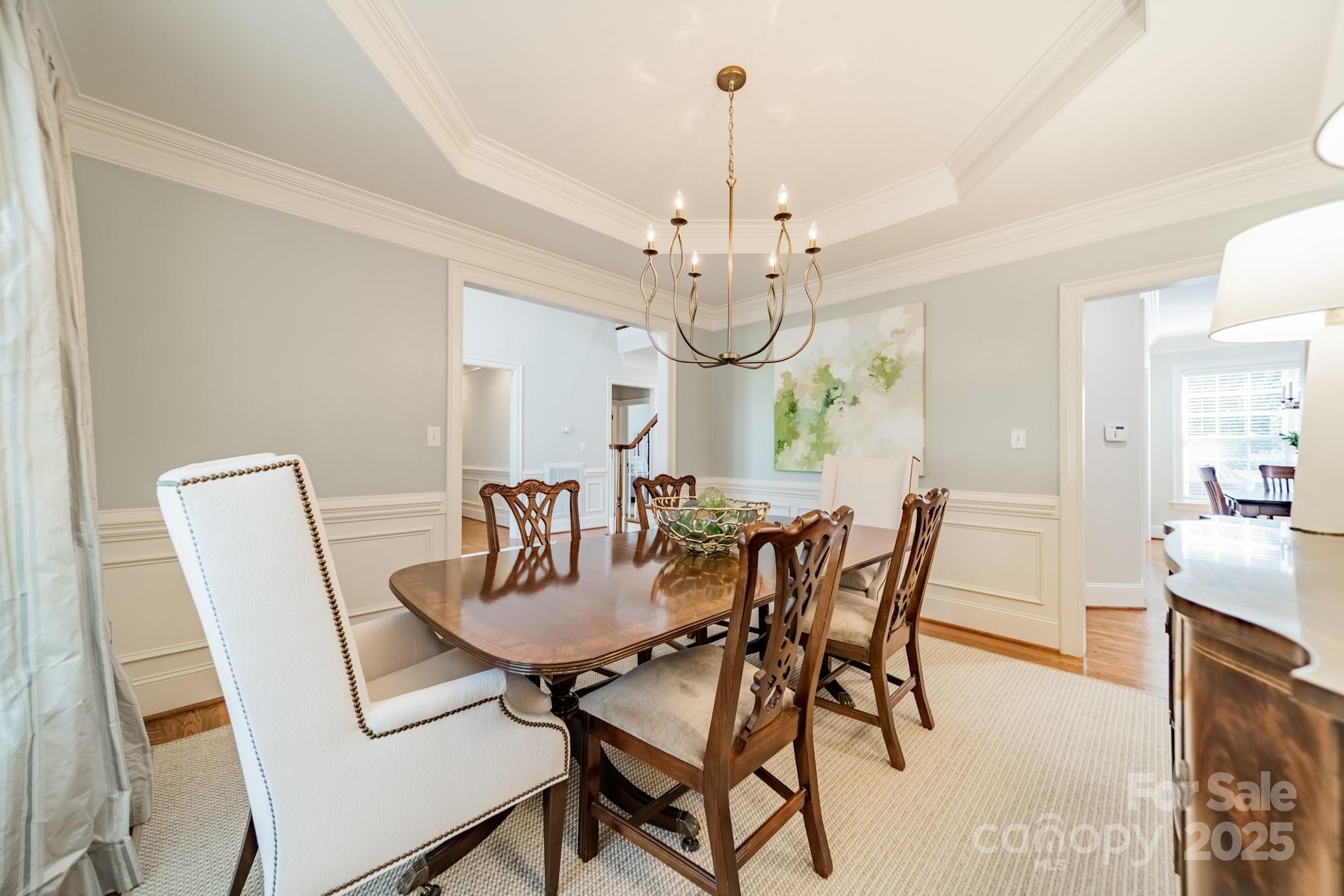 788 Portpatrick Place Fort Mill, SC 29708 - Photo 8 of 48 a view of a dining room with furniture and chandelier