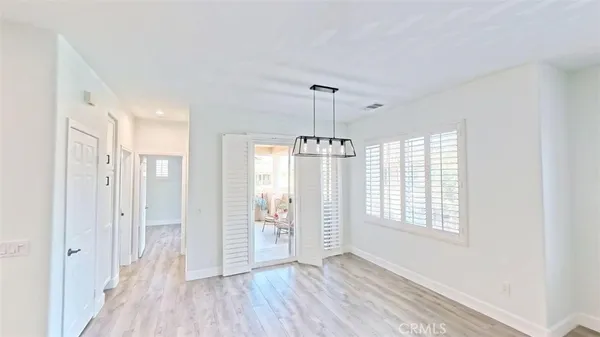 a view of entryway with wooden floor