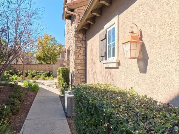 a view of a pathway both side of the house
