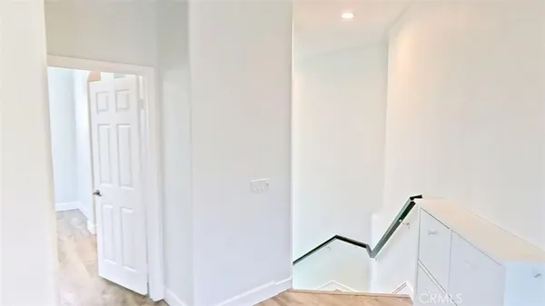 a view of a hallway with staircase