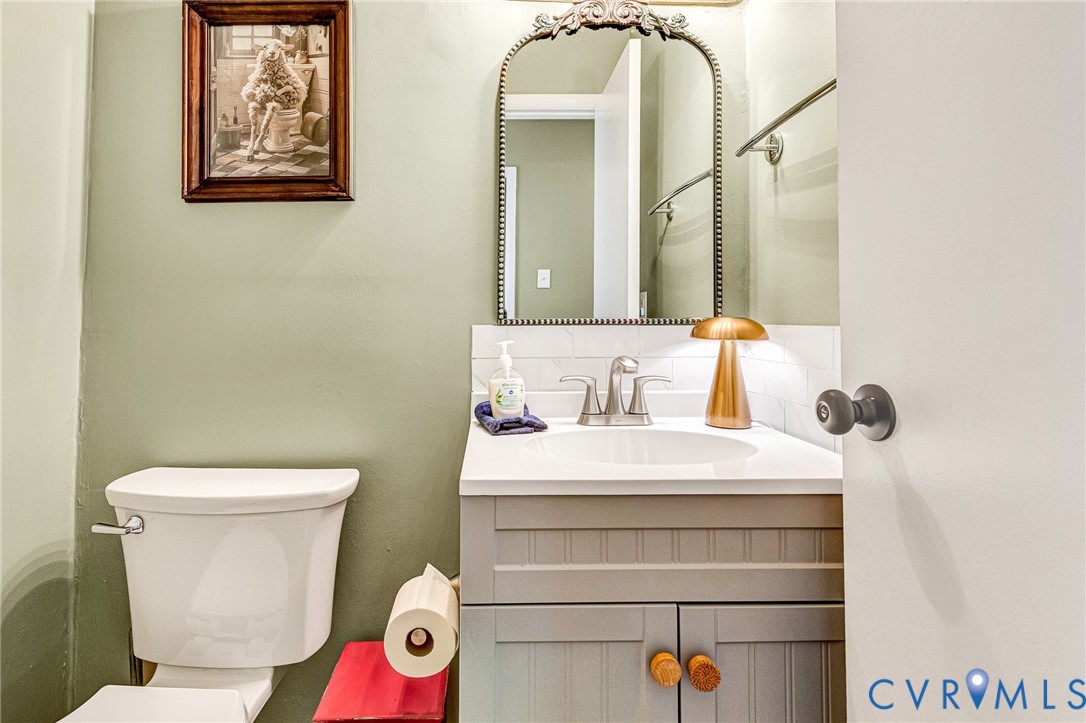 11713 South Briar Patch Drive Midlothian, VA 23113 - Photo 11 of 23 a bathroom with a toilet sink and mirror