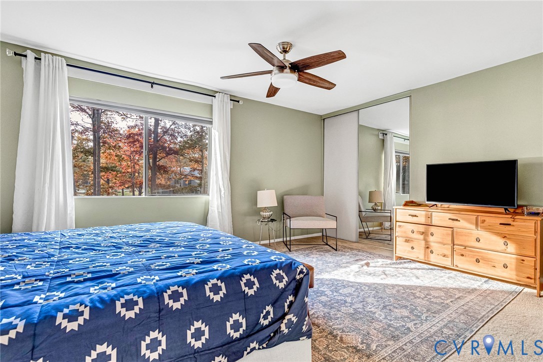11713 South Briar Patch Drive Midlothian, VA 23113 - Photo 13 of 23 a bedroom with a bed and a flat screen tv