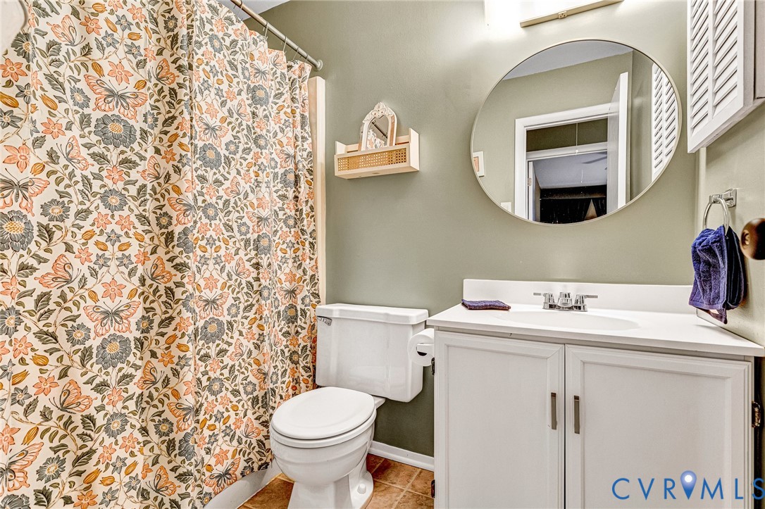 11713 South Briar Patch Drive Midlothian, VA 23113 - Photo 18 of 23 a bathroom with a sink toilet and a mirror