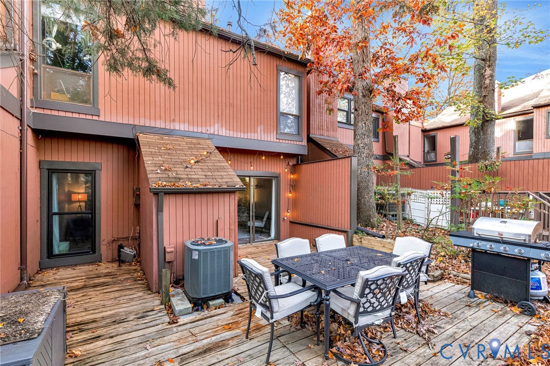 11713 South Briar Patch Drive Midlothian, VA 23113 - Photo 20 of 23 a table and chairs in front of a house