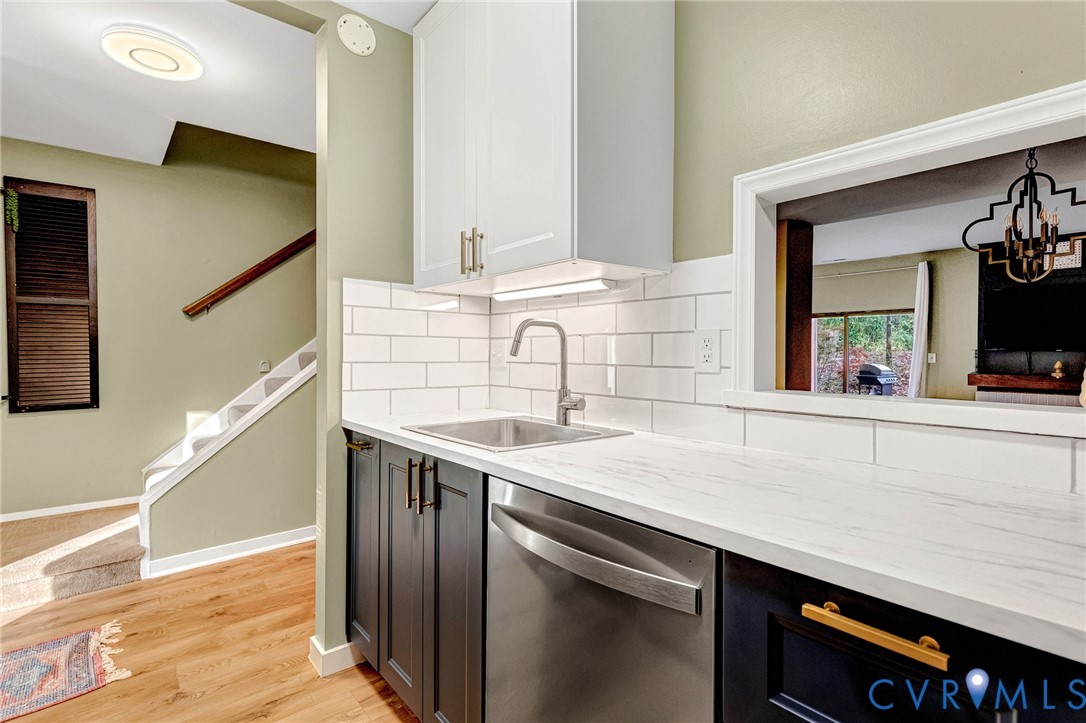 11713 South Briar Patch Drive Midlothian, VA 23113 - Photo 2 of 23 a kitchen with a sink and a refrigerator