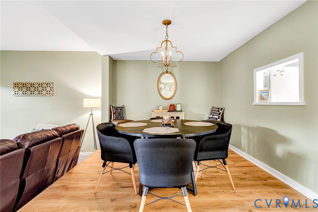 11713 South Briar Patch Drive Midlothian, VA 23113 - Photo 7 of 23 a view of a dining room with furniture and wooden floor