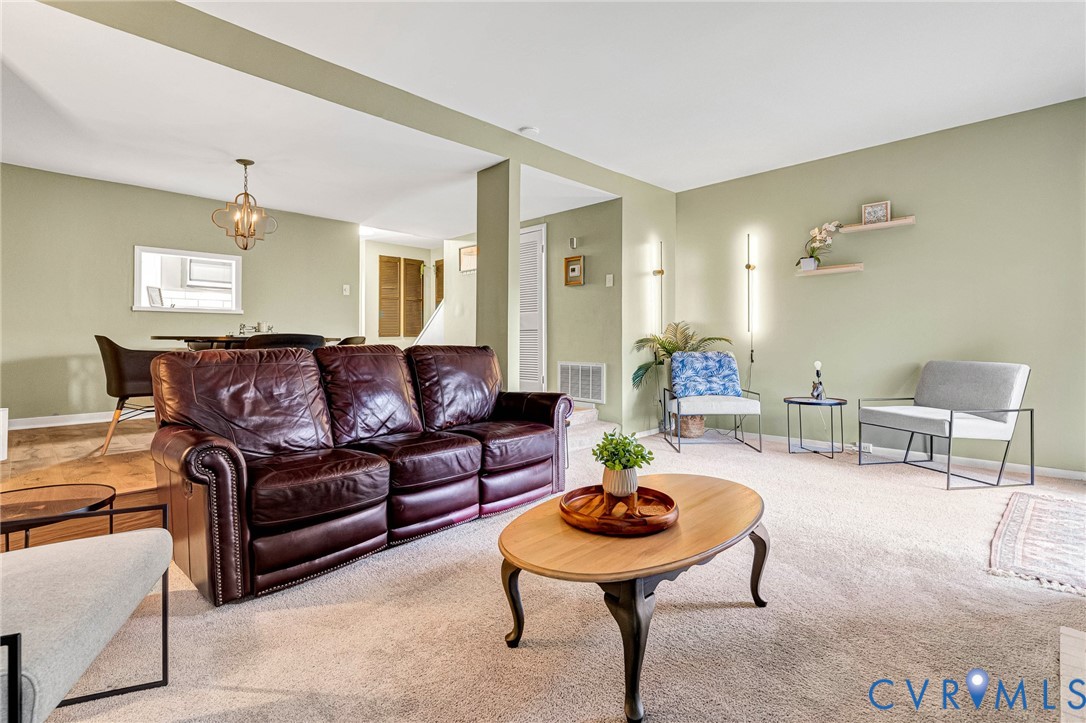 11713 South Briar Patch Drive Midlothian, VA 23113 - Photo 9 of 23 a living room with furniture and a wooden floor