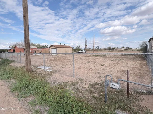 a view of a parking area with lots of trees