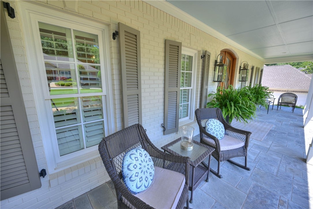 Welcoming front porch with flagstone paver floor