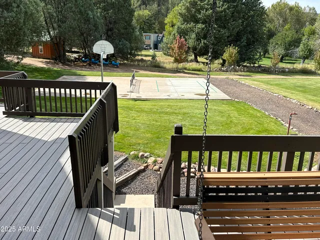 a view of a swimming pool with a deck