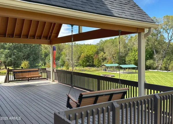 a view of a two chairs in the deck