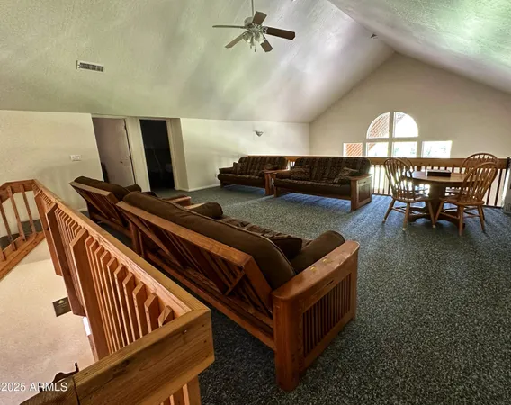a view of a livingroom with furniture and a flat screen tv