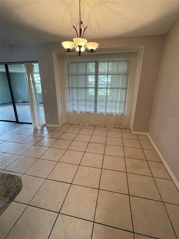 1427 Chamberlain Loop Lake Wales, FL 33853 - Photo 4 of 7 a view of an empty room with a window