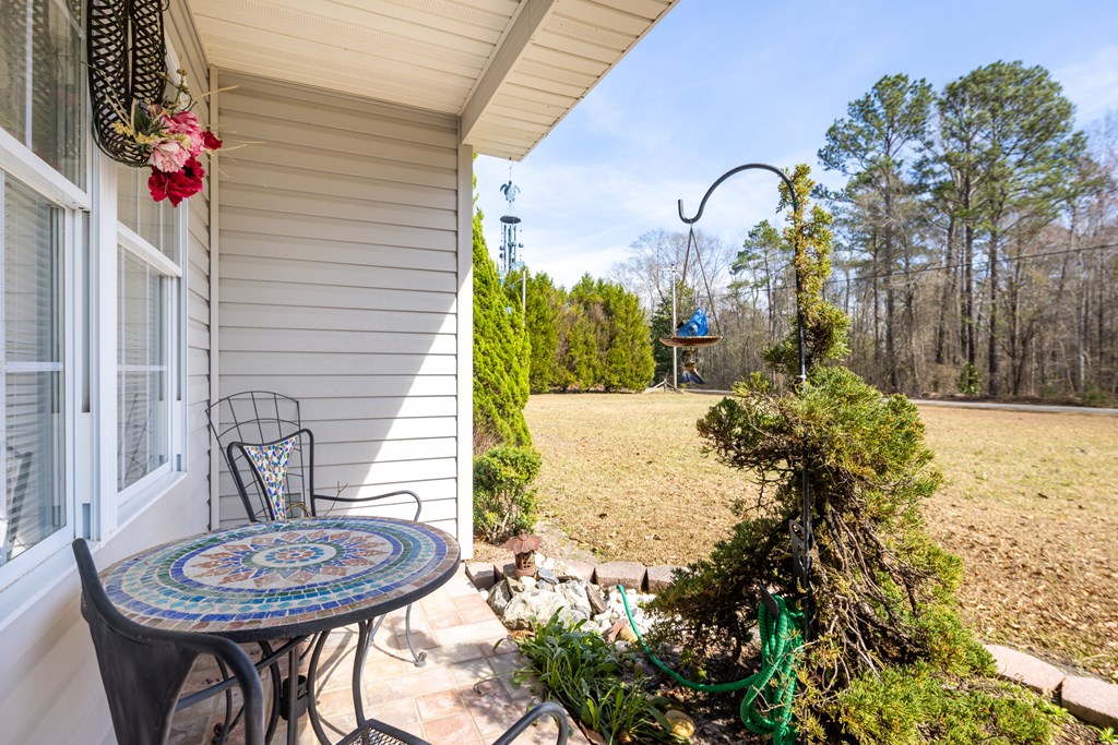 29 Bon Acre Road Fort Mitchell, AL 36856 - Photo 7 of 38 a view of a chair and table in backyard
