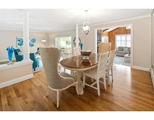 115 Prospect Street Hingham, MA 02043 - Photo 11 of 27 a dining room with furniture a chandelier and wooden floor