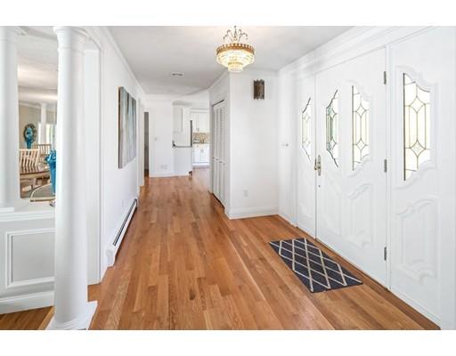 115 Prospect Street Hingham, MA 02043 - Photo 12 of 27 a view of a hallway with wooden floor and staircase