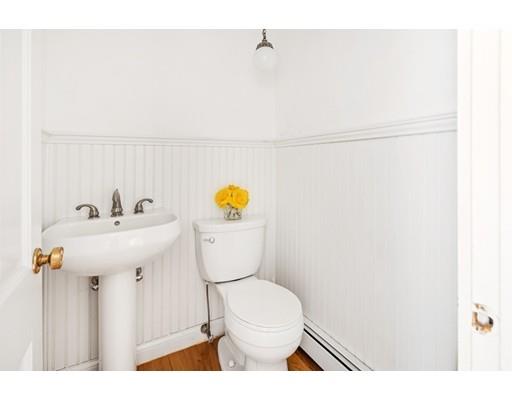 115 Prospect Street Hingham, MA 02043 - Photo 13 of 27 a bathroom with a sink a toilet and mirror