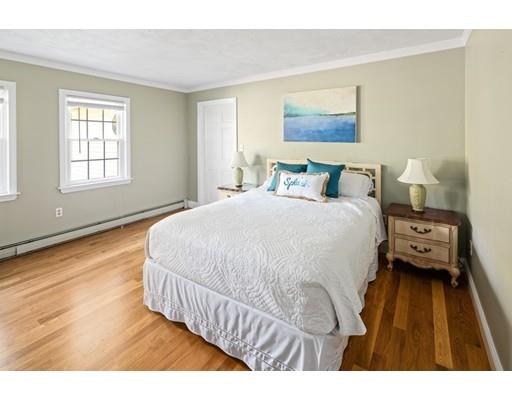 115 Prospect Street Hingham, MA 02043 - Photo 19 of 27 a spacious bedroom with a bed and wooden floor