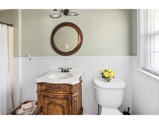 115 Prospect Street Hingham, MA 02043 - Photo 20 of 27 a bathroom with a sink mirror vanity and a toilet