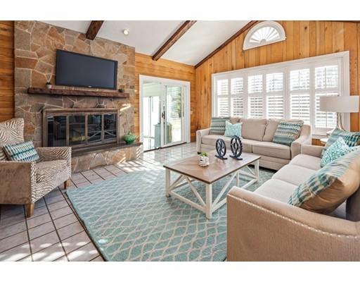 115 Prospect Street Hingham, MA 02043 - Photo 8 of 27 a living room with furniture a flat screen tv and a fireplace