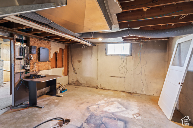 465 North Main Street Richfield, UT 84701 - Photo 32 of 43 Basement featuring electric panel and water heater