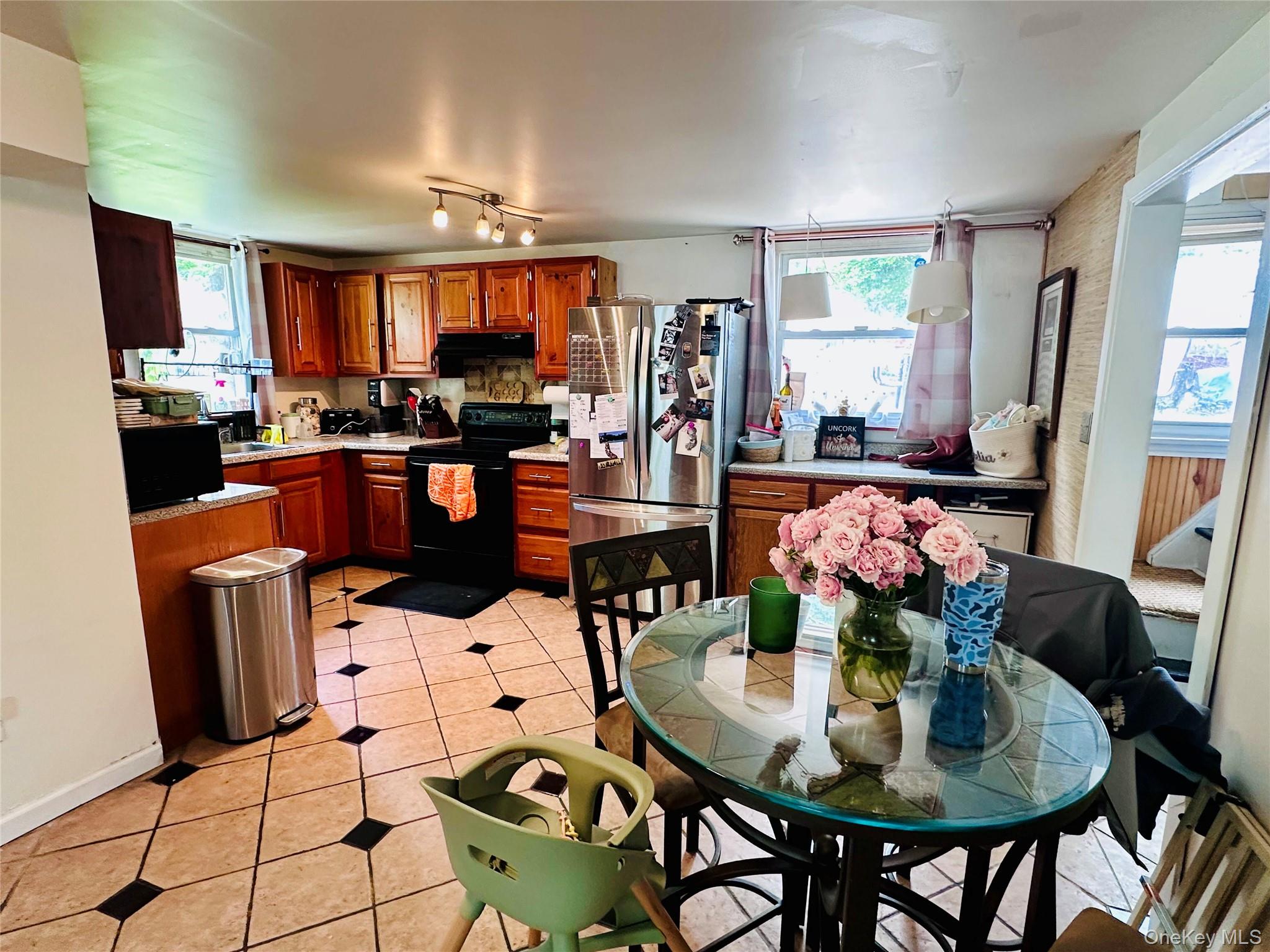 15 Pops Road Cortlandt Manor, NY 10567 - Photo 10 of 14 a dining room filled with furniture and chandelier