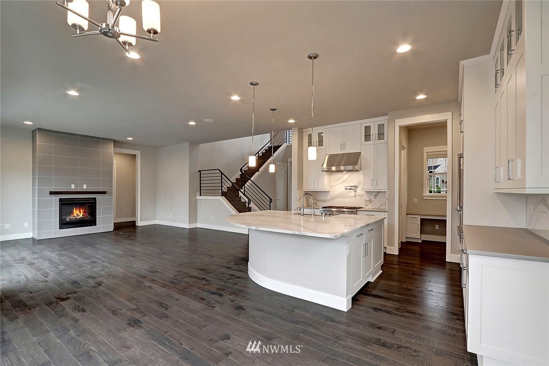 21813 33rd Drive Southeast, Unit 36 Bothell, WA 98021 - Photo 6 of 22 a large kitchen with cabinets and wooden floor
