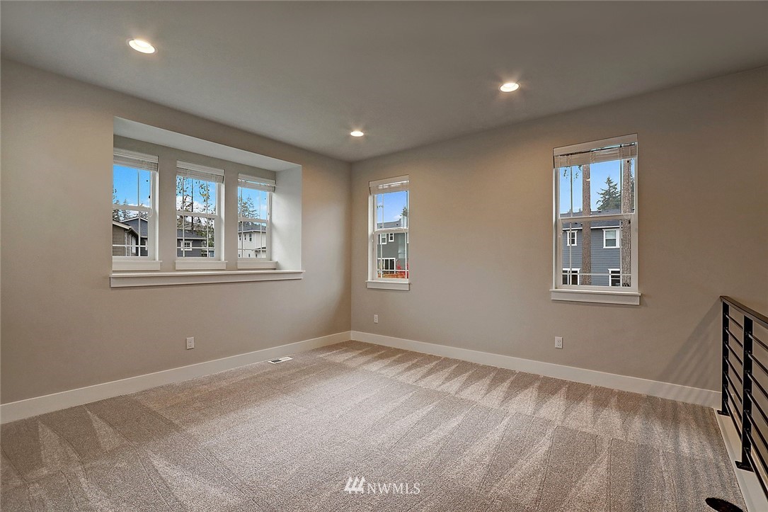 21813 33rd Drive Southeast, Unit 36 Bothell, WA 98021 - Photo 10 of 22 a view of empty room with windows