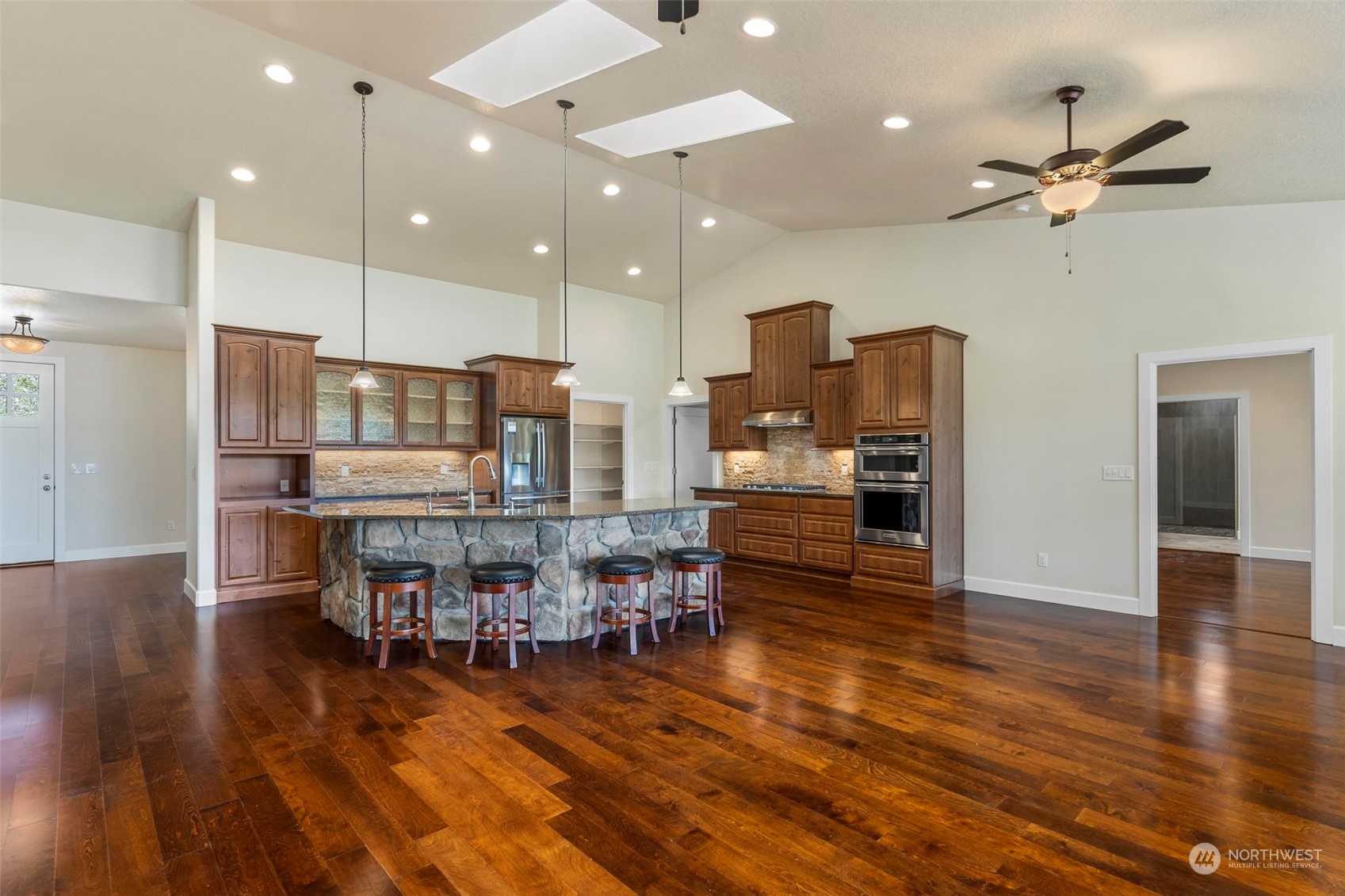 191 Collins Road Toledo, WA 98591 - Photo 8 of 40 a dining room with stainless steel appliances wooden floor dining table and chairs
