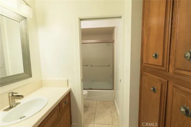 a view of a living room with furniture and a fireplace