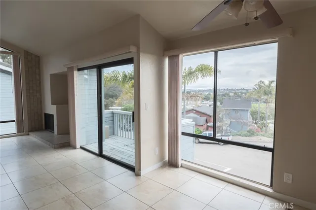 a large white kitchen with a sink and cabinets