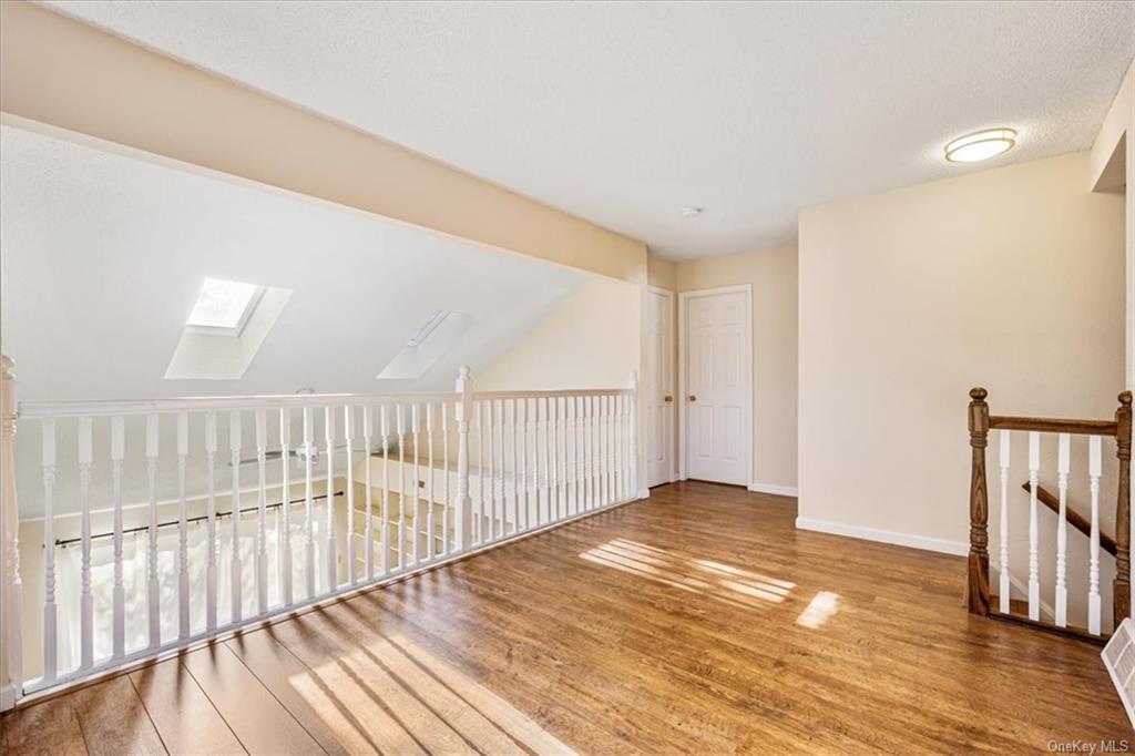 1 Chadwick Court Fishkill, NY 12524 - Photo 19 of 35 Additional living space with hardwood / wood-style flooring and a skylight