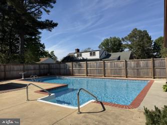 8 Shawnee Road Cambridge, MD 21613 - Photo 2 of 5 a view of swimming pool with seating space