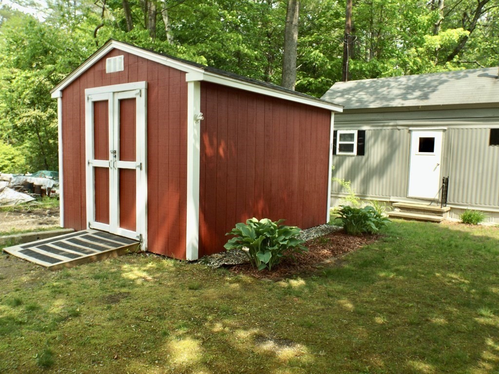 9 Bray Road Buckland, MA 01370 - Photo 3 of 25 a view of backyard with potted plants and wooden fence