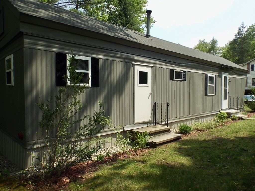 9 Bray Road Buckland, MA 01370 - Photo 4 of 25 a backyard with a garden and plants