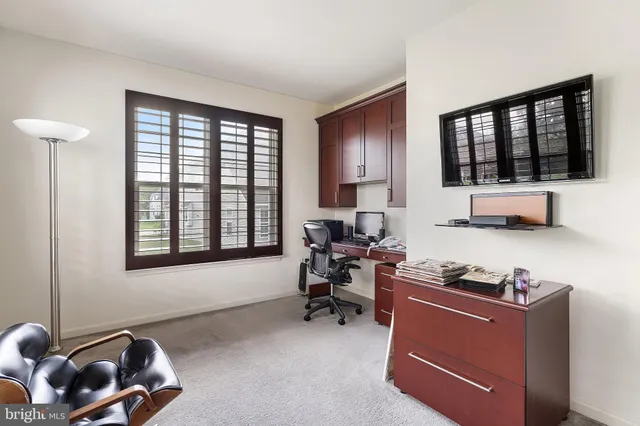 a bedroom with a bed and a lamp