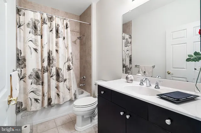 a spacious bedroom with a bed and large window