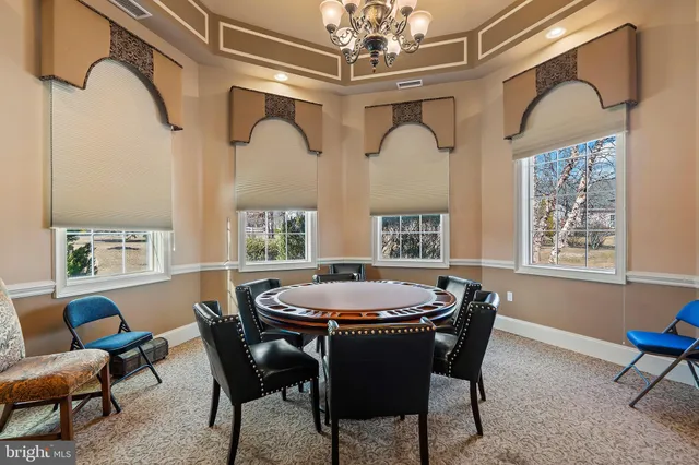 a kitchen with granite countertop a sink stove and cabinets