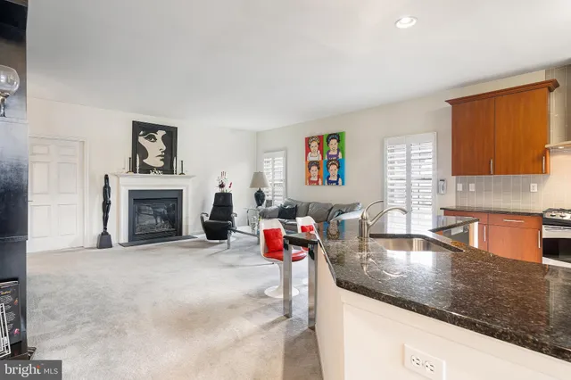 a living room with fireplace furniture and a flat screen tv