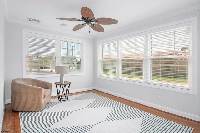 a living room with furniture and windows