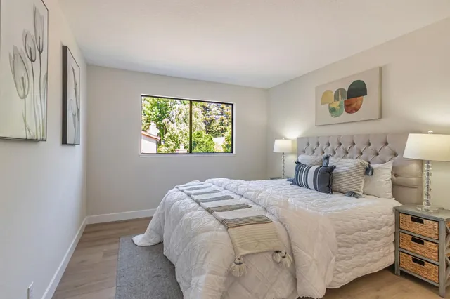 a bedroom with bed and a window