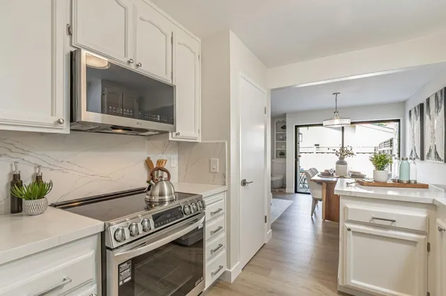 a kitchen with a stove and a microwave