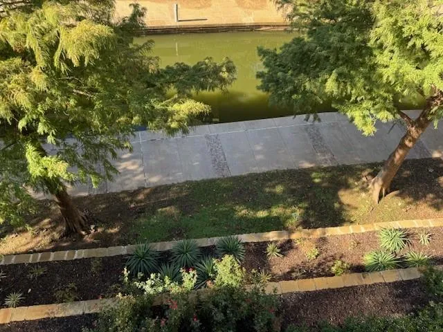 a view of a street from a balcony