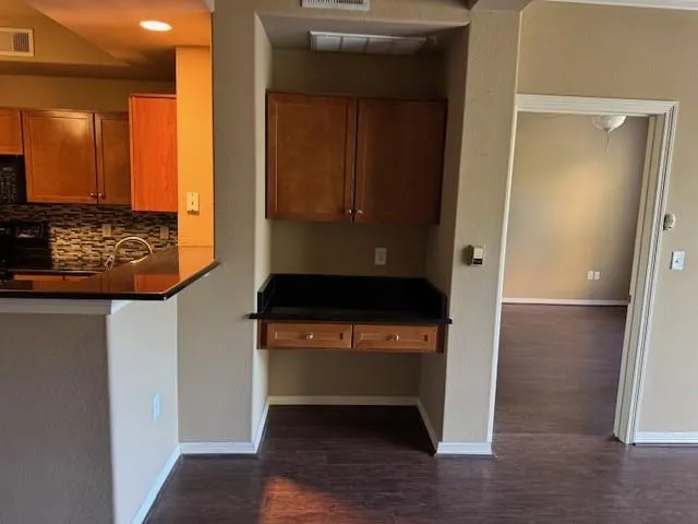 a view of front door with wooden floor