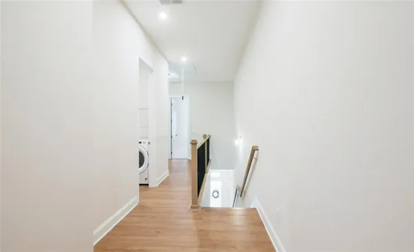 en empty room with a ceiling fan and a shower